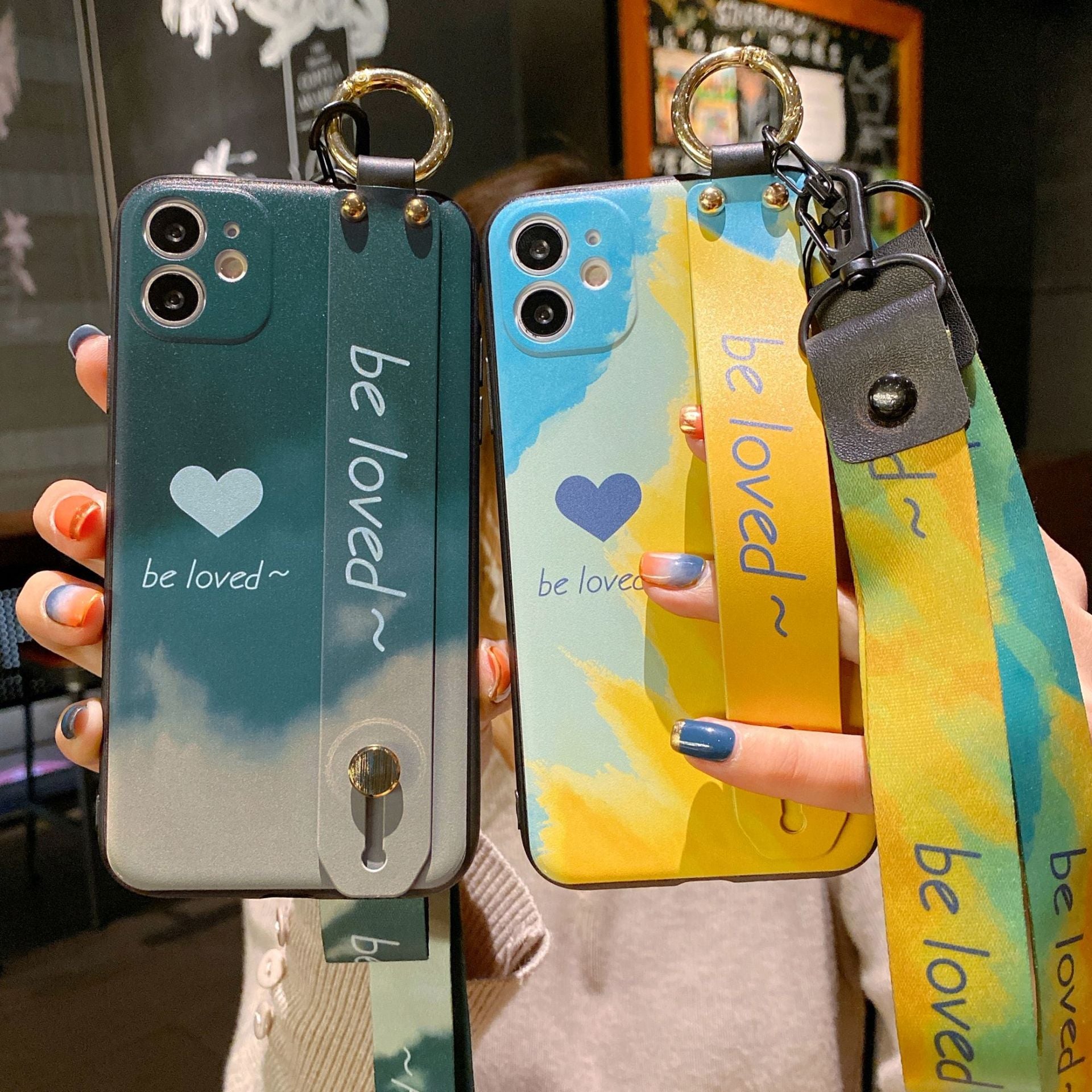 Custodia per telefono con cinturino da polso e custodia per telefono con motivo acquerello