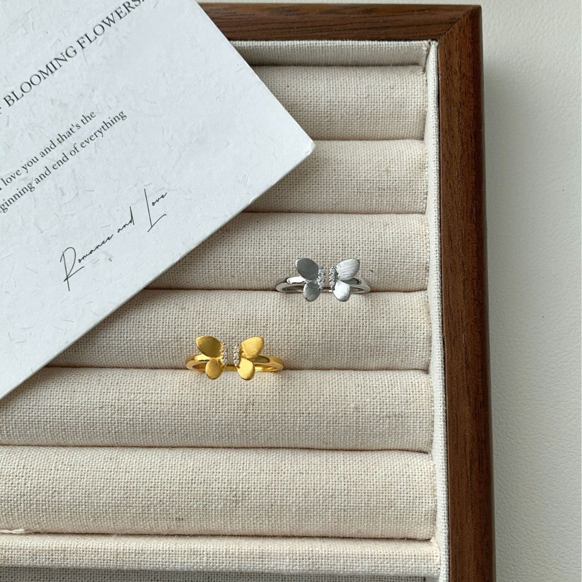 A Sophisticated Butterfly Ring With A Ribbon And Diamond Detailing.