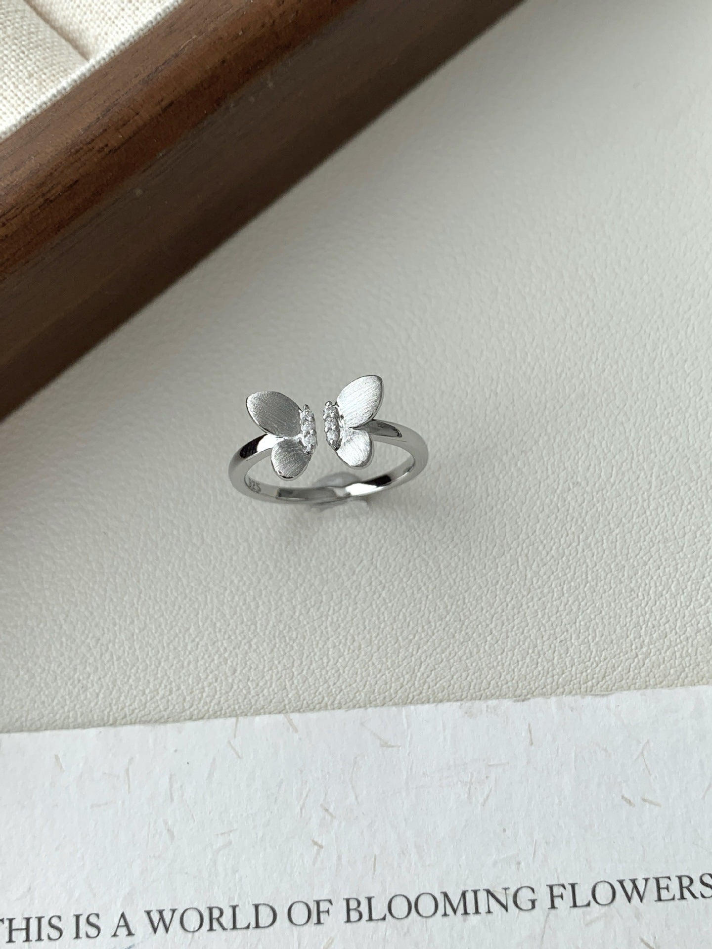 A Sophisticated Butterfly Ring With A Ribbon And Diamond Detailing.