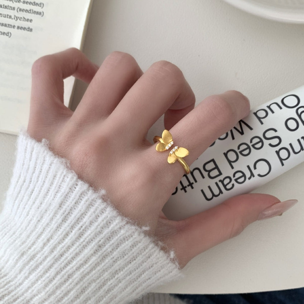 A Sophisticated Butterfly Ring With A Ribbon And Diamond Detailing.