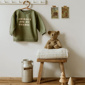 Green letter sweater