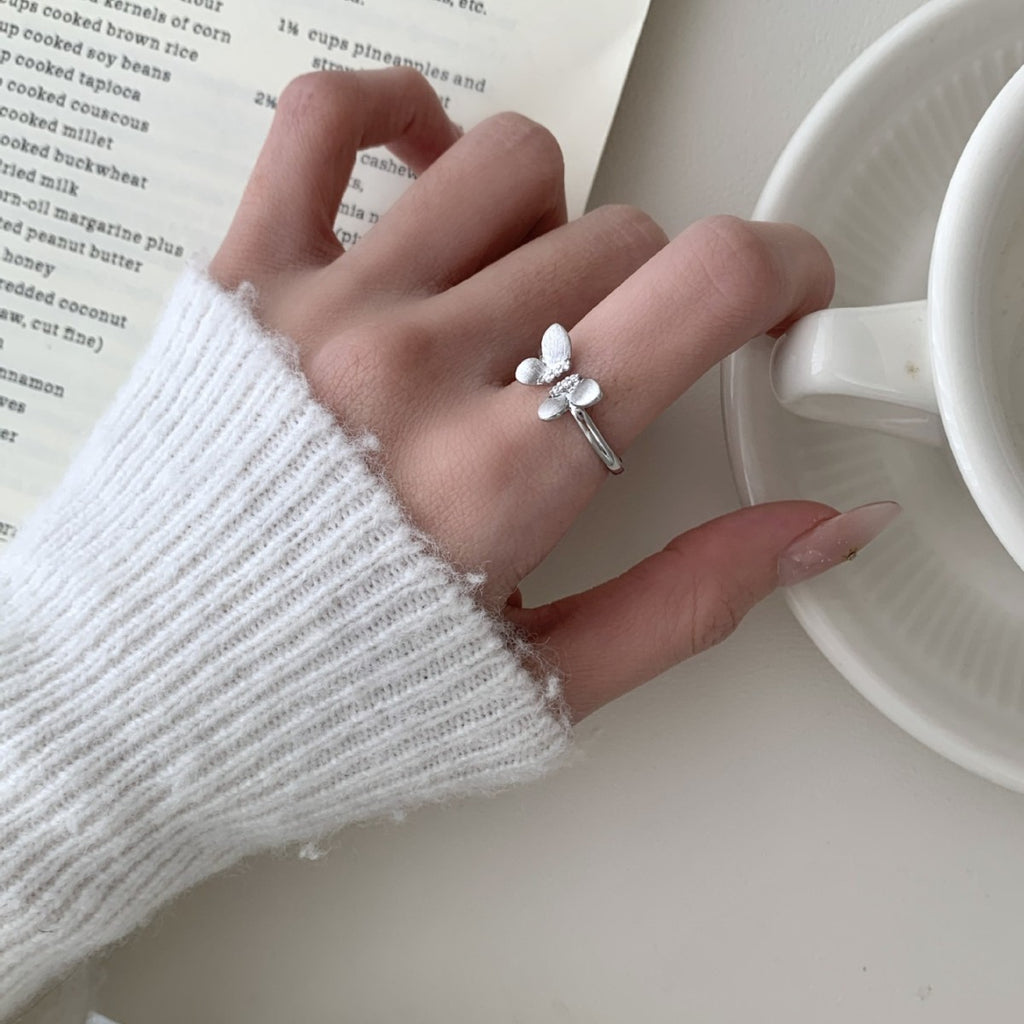 A Sophisticated Butterfly Ring With A Ribbon And Diamond Detailing.