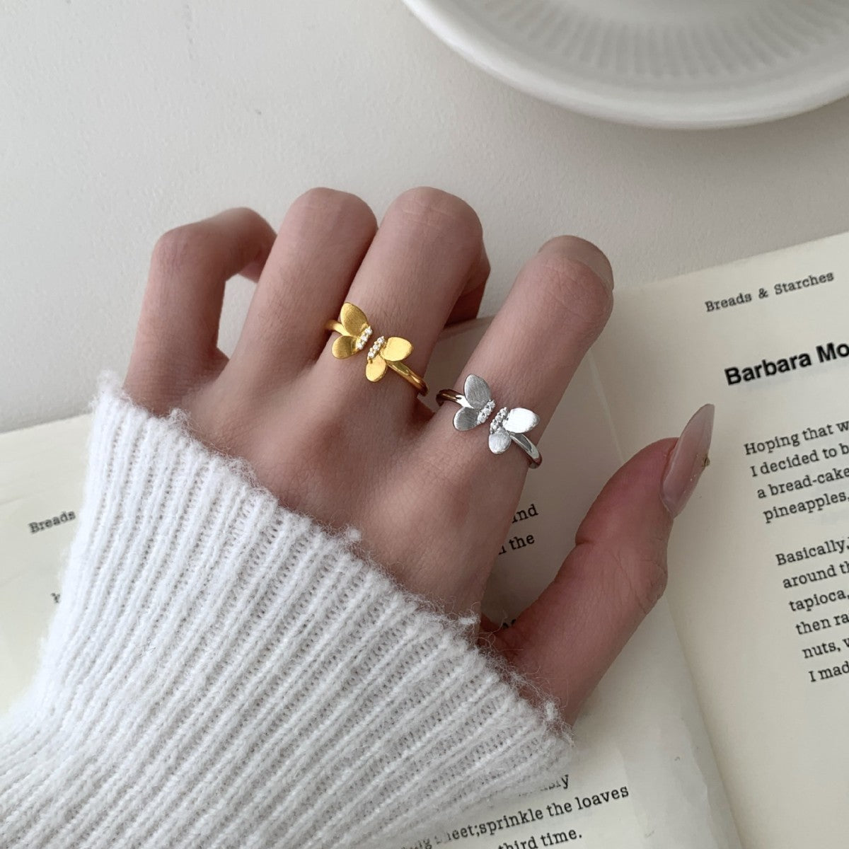A Sophisticated Butterfly Ring With A Ribbon And Diamond Detailing.